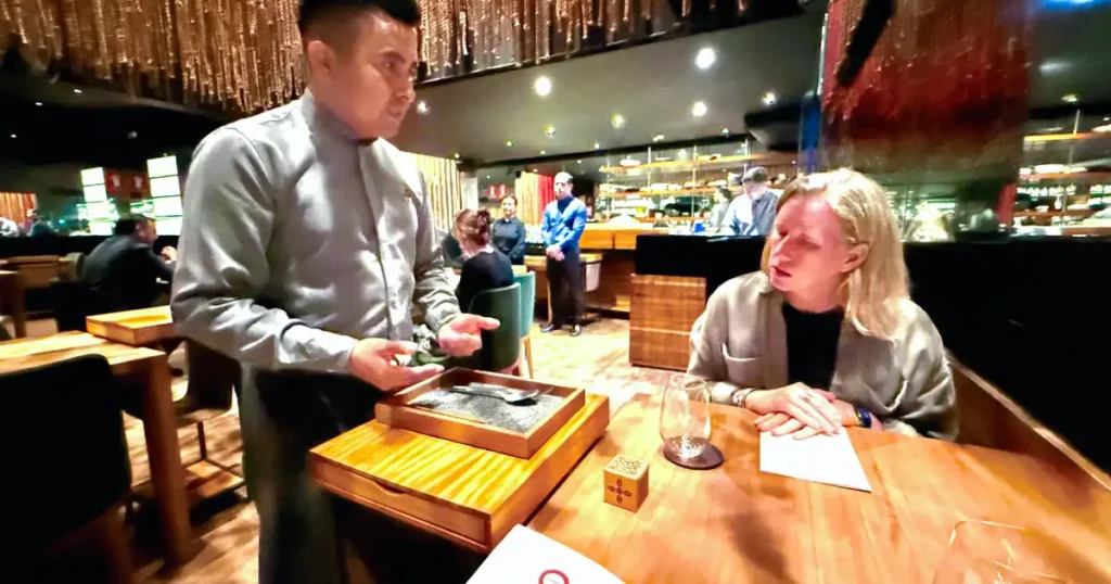 Dinner at Maido with Waiter Explaining Menu