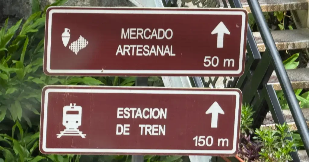 Signs for Market and downtown Aguas Calientes