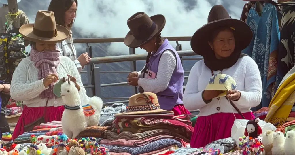 Women working with Alpaca wool in the sacred valley of peru
